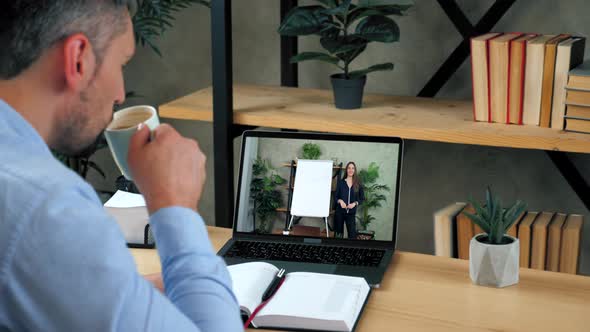 Woman Teacher in Computer Screen Near Whiteboard Greets Tells Teaches Student