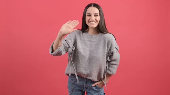 Friendly Beautiful Woman Saying Hi and Smiling, Welcoming Friends with Hand.