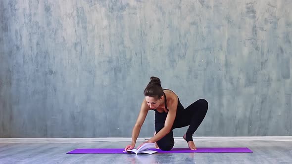 Woman Sports Clothes Leggings and a Tank Top Engaged Yoga Studio with