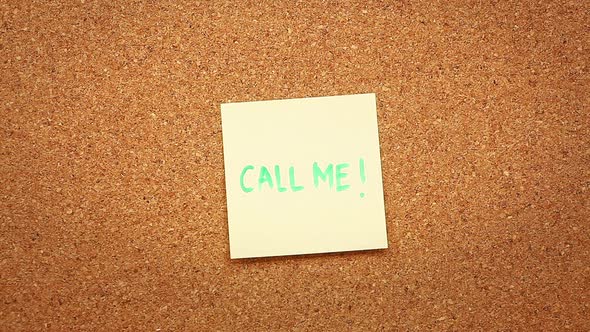 "Call me" on a cork board