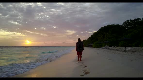 Lady happy and smiling on paradise seashore beach lifestyle by turquoise water and white sand backgr