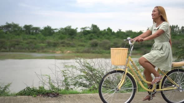 woman riding a bike on the park