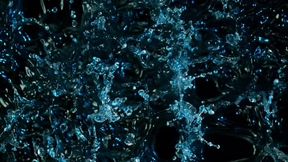 Super Slow Motion Abstract Shot of Splashing Blue Neon Water at 1000Fps