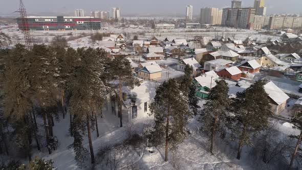 Aerial view of cottage village on the outskirts of the city with forest 14