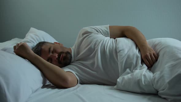 Annoying Mosquitoes Disturbing Man in Bed Needs Insect Repellent and Window Nets