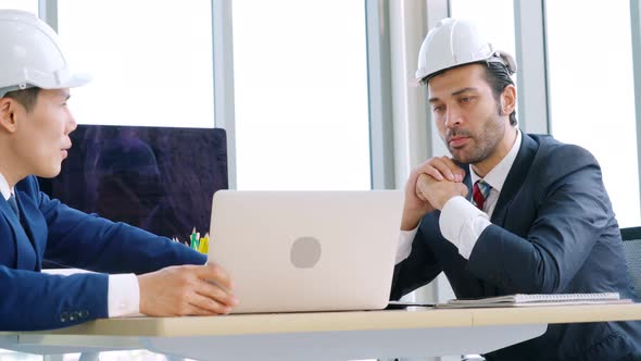 Engineer and Architect Meeting at Office Table