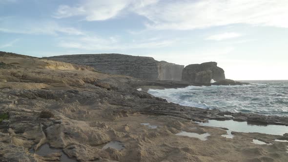 Walking on Stone Beach near Azure Window in Gozo Island During Winter