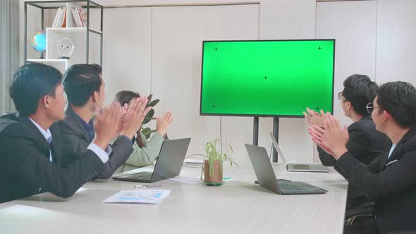 Asian Team Have Meeting In A Conference Room, Have Conference Video Call Tv Mock Up Green Screen