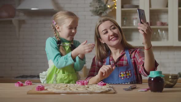 Family Live Streaming with Phone During Cooking