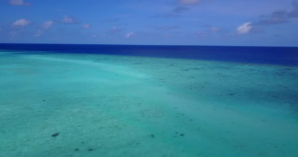 Beautiful drone copy space shot of a sunshine white sandy paradise beach and turquoise sea backgroun