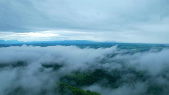 4K Aerial Drone shot flying over beautiful mountain ridge in rural jungle bush forest.