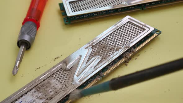 Service Center Worker Cleans Dust at Random Access Memory