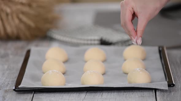 Woman Hand Sprinkling Flour Over Dough, Sprinkle Wheat Flour on Bread Dough