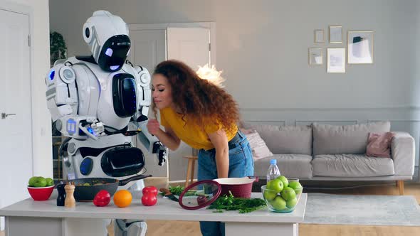 Cyborg Is Giving Food To the Lady for Her To Try