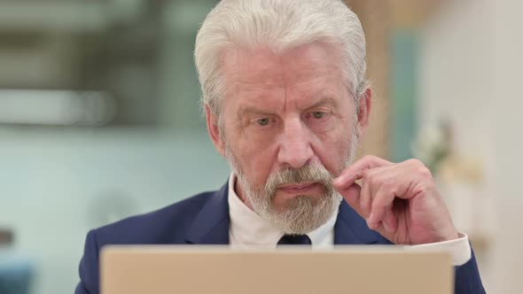 Close Up of Senior Old Businessman Using Laptop