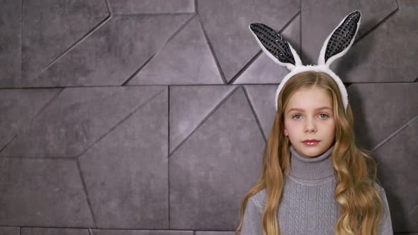 Portrait of a Cute Little Girl Dressed in Ears Easter Bunny