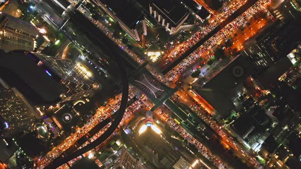 Aerial view of Sathorn intersection or junction with cars traffic, Bangkok Downtown. Thailand.