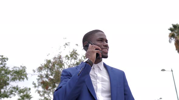 Businessman using smartphone in city