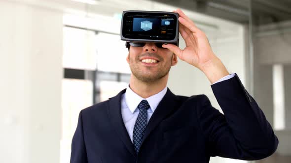 Businessman with Vr Headset and Cube on Screen