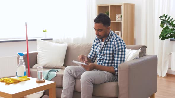 Indian Man with To Do List After Home Cleaning 18