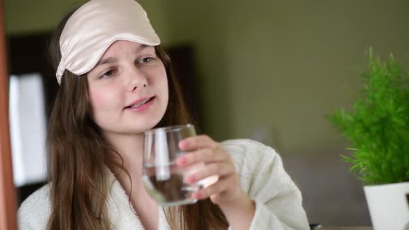 Girl drinking water in the morning, health care natural balance concept