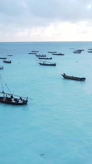 Vertical Video Boats in the Ocean Near the Coast of Zanzibar Tanzania