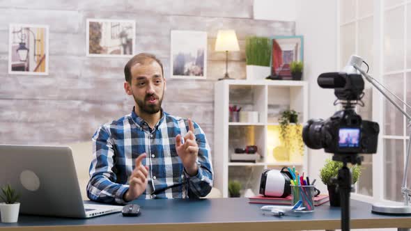 Caucasian Vlogger Recording a Podcast for Social Media