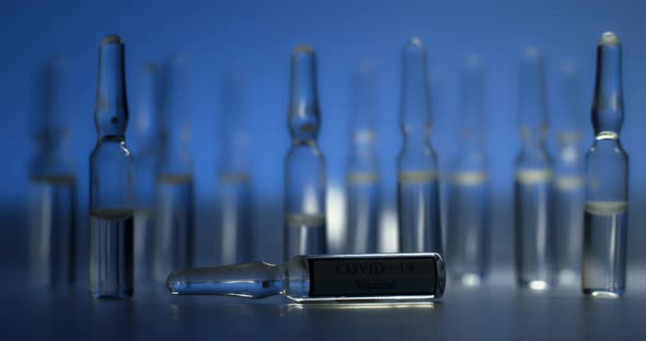 A Beam of Light Illuminates Ampoules Containing the COVID19 Vaccine