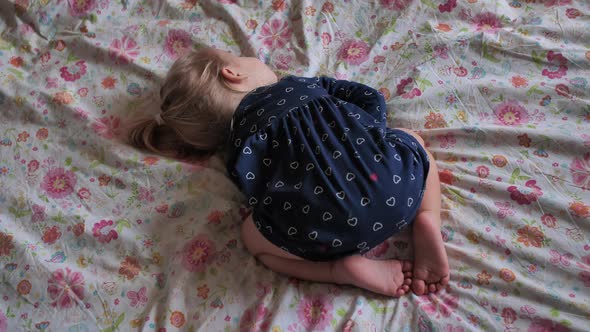 The Little Girl Sleeps Funny on the Crusts. alt