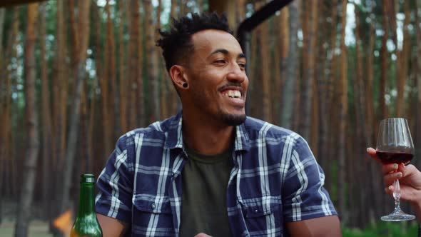 African Happy Man Listening to Somebody Outside