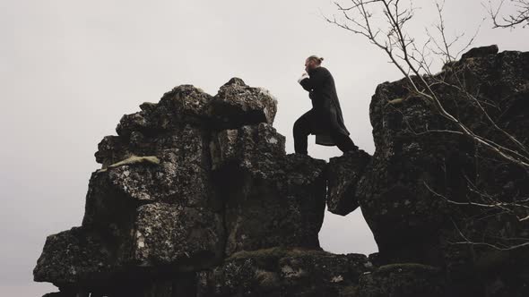 Kung Fu Master Performing Martial Arts On Rocks