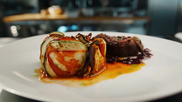 Ready dish filet mignon and ratatouille in the restaurant kitchen