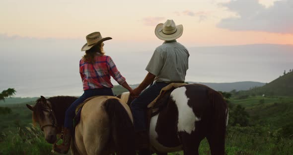 Couple Horseback Riding