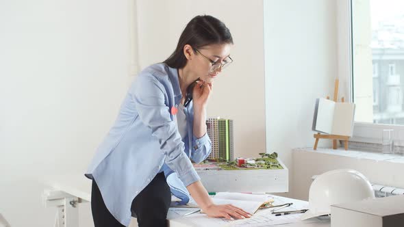 Professional Designer Enjoying Her Work in Office with Modern Interior