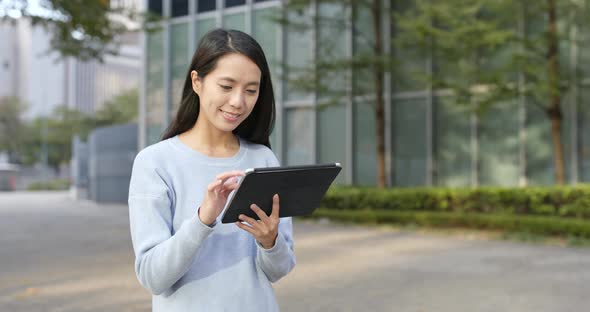 Woman use of mobile phone at outdoor