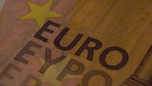 Word EURO close up on the banknote of the European currency
