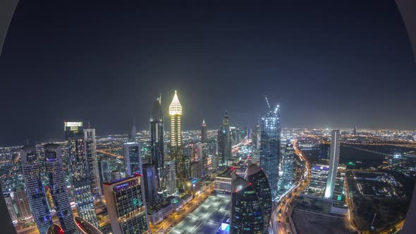 Skyline of the Buildings of Sheikh Zayed Road and DIFC Aerial Night Timelapse in Dubai UAE