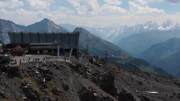 Aerial View the Old Red Elevator Cabin Rises to the Cable Car Station in the Highlands Against the