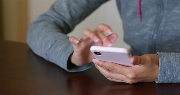 Woman touch on cellphone at home