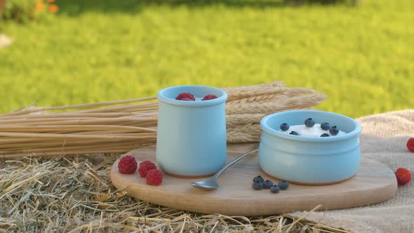 Yogurt with Berries and Sheaf of Wheat Ears