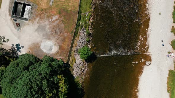 Ariel Drone footage of a peaceful river surrounded by farmland on a summers day in the Yorkshire Dal