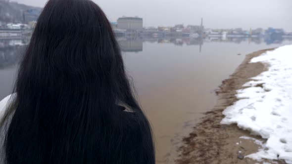 Beautiful Woman With Sad Emotion Walks On River Bank Thinking. Winter Slow Motion 3