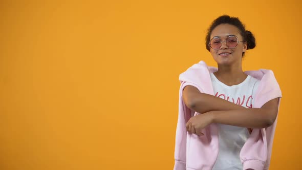 Confident Teenage Girl Posing on Yellow Background, Courses of Fashion and Style