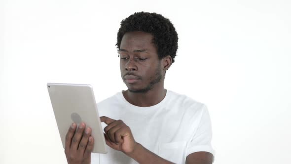 African Man Reacting to Loss on Tablet White Background