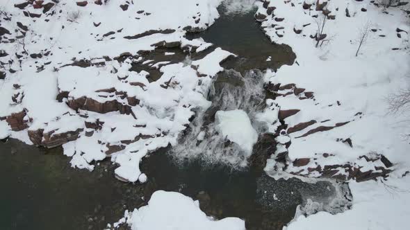 Ariel small frozen waterfall during winter