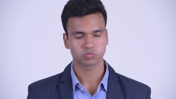 Face of Serious Young Indian Businessman Nodding Head No