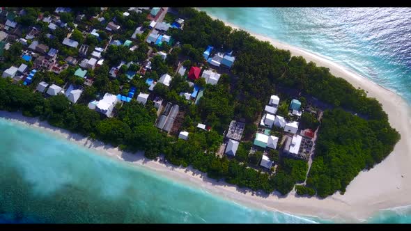 Aerial drone shot abstract of beautiful lagoon beach holiday by blue green water and white sandy bac