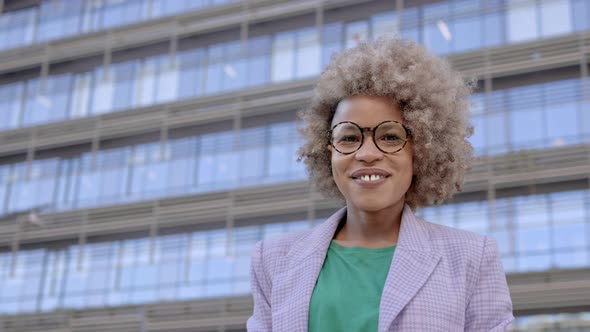Portrait of Professional African American Business Woman with Blond Hair and Modern Eyeglasses in