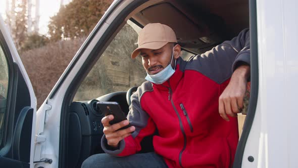 Driver with Face Mask Under the Chin Using Smartphone