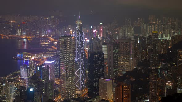 Hong Kong Urban Cityscape Aerial Skyline Panorama Timelapse at Night Pan Up